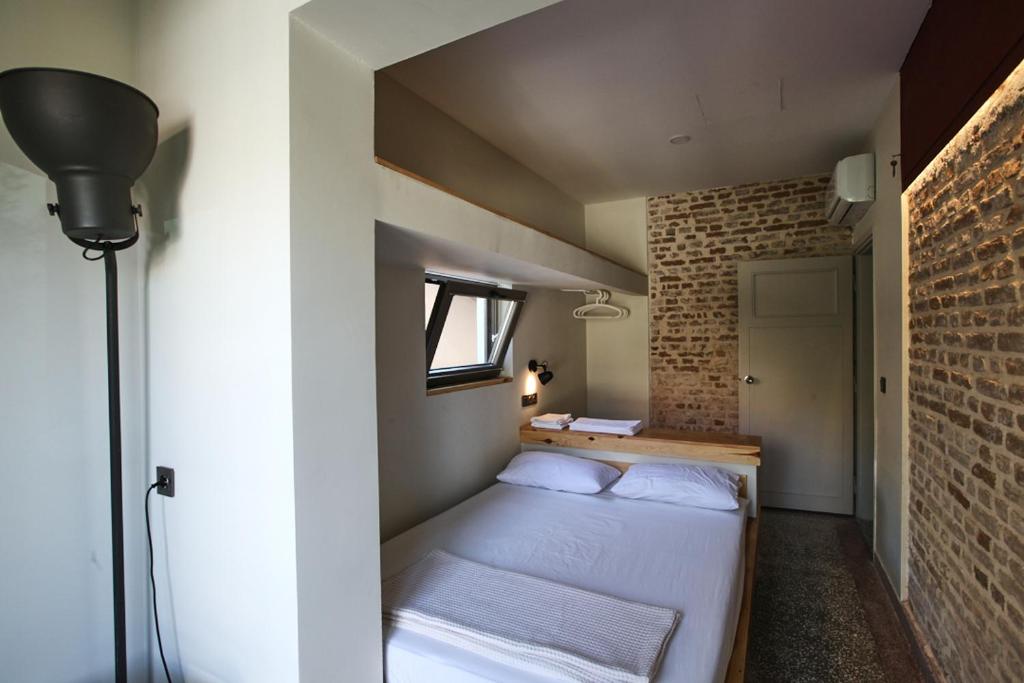 Postel nebo postele na pokoji v ubytování FLANEUR HOSTEL
