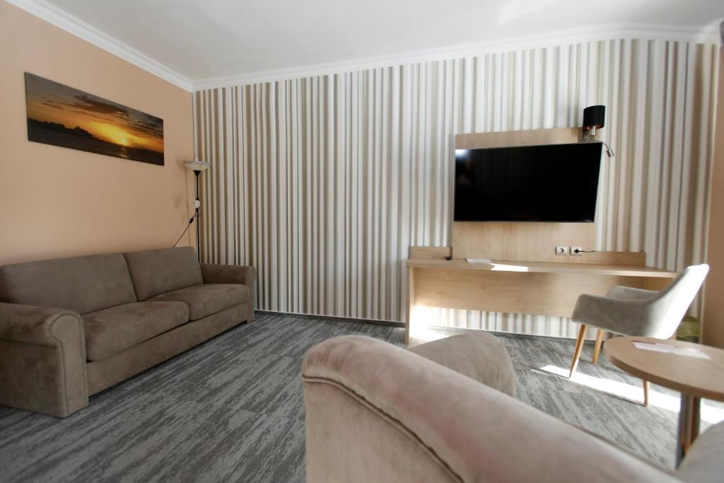 TV a/nebo společenská místnost v ubytování Wellness Hotel Laroba