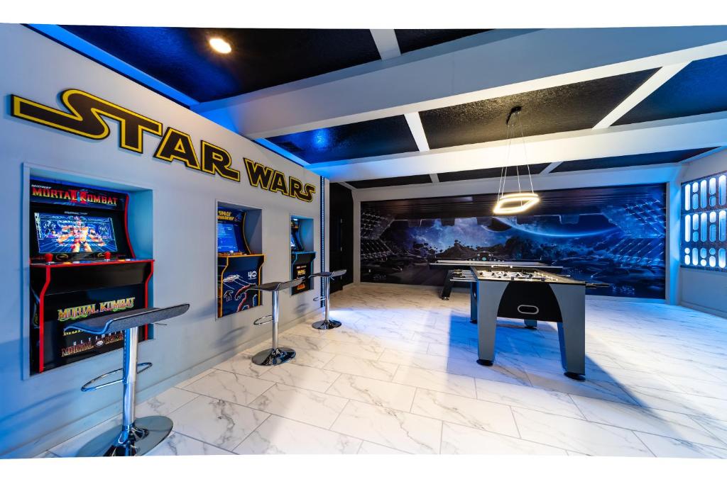 a star wars game room with a ping pong table at STAR WARS GAME ROOM -Private Pool -FREE Waterpark in Kissimmee