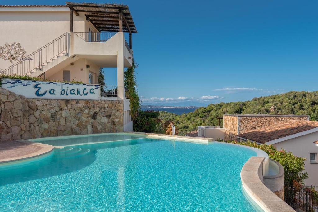 a swimming pool in a villa with a view at Residence Ea Bianca in Baja Sardinia