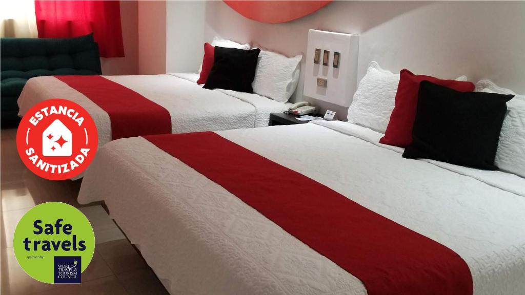 Postel nebo postele na pokoji v ubytování Hotel Dluxe
