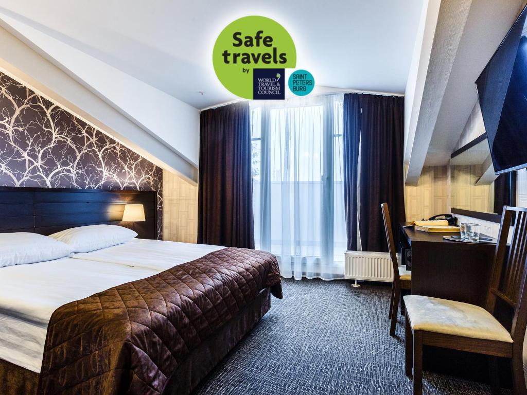 Łóżko lub łóżka w pokoju w obiekcie Hotel Alfavit