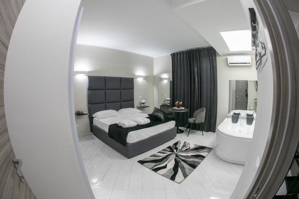 Postel nebo postele na pokoji v ubytování Hotel Trionfal
