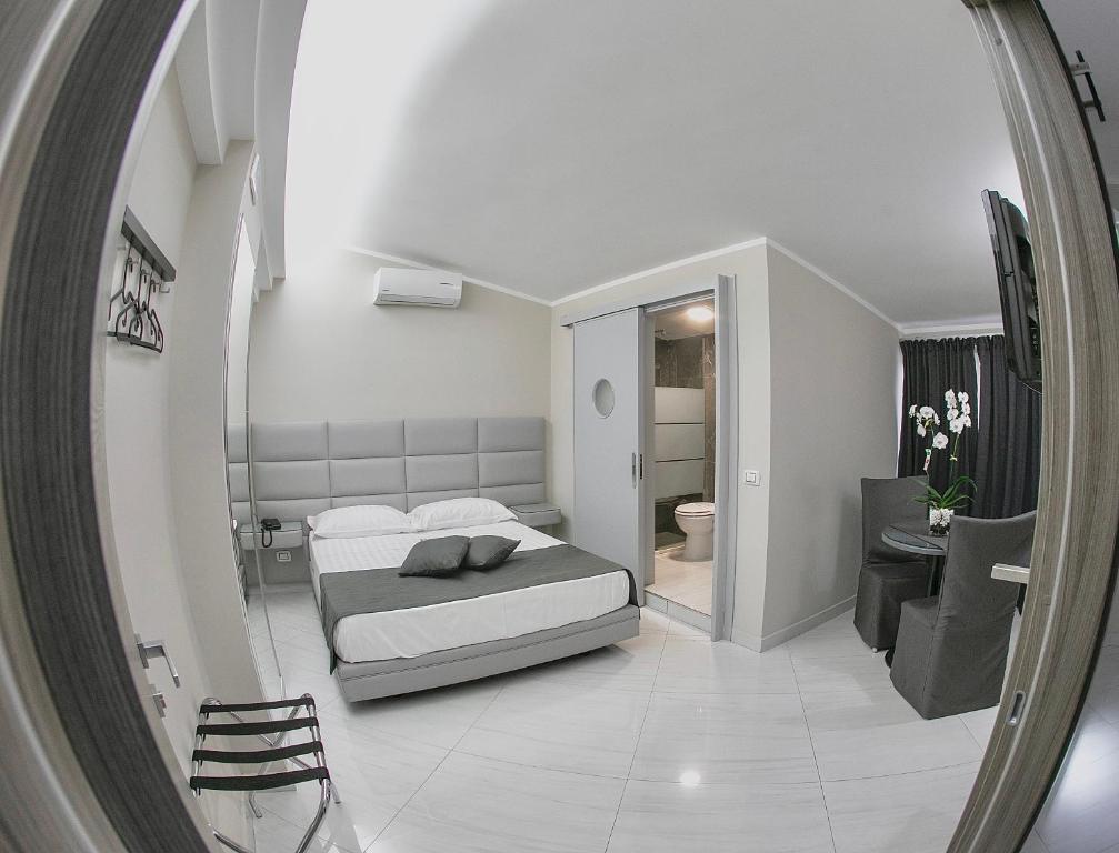 Postel nebo postele na pokoji v ubytování Hotel Trionfal