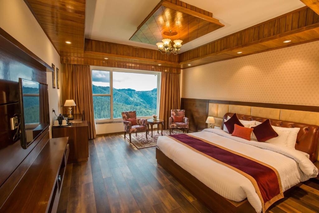 Postel nebo postele na pokoji v ubytování The Retreat Mashobra, Shimla