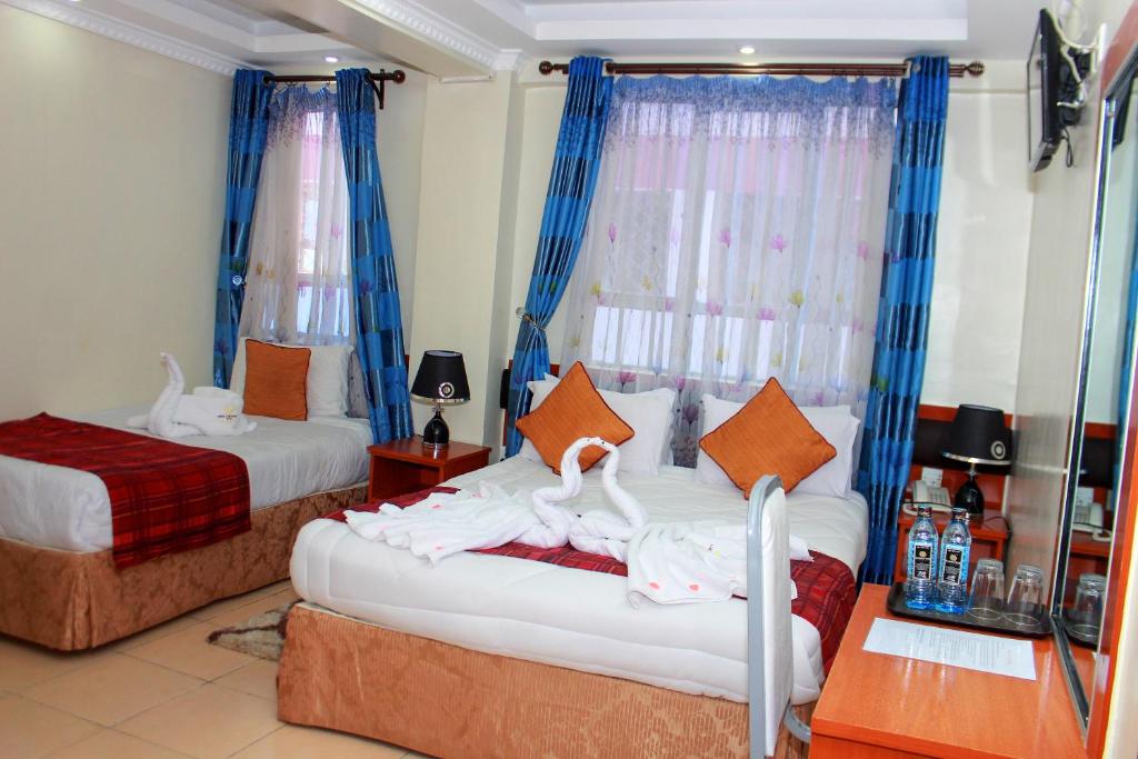 Postel nebo postele na pokoji v ubytování Sheratton Regency Hotel Nairobi
