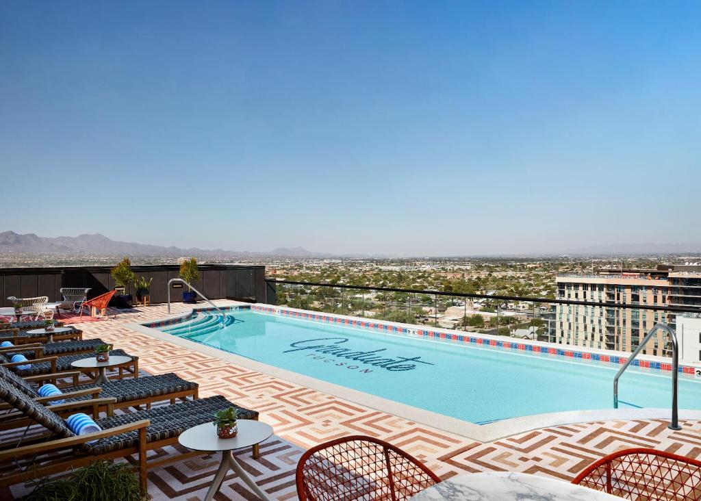 a swimming pool on top of a building with a view at Graduate Tucson in Tucson