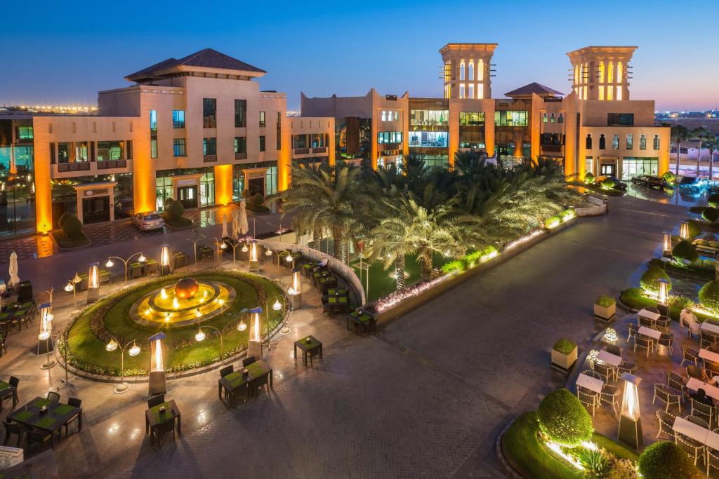 an aerial view of a city at night at Al Mashreq Boutique Hotel in Riyadh