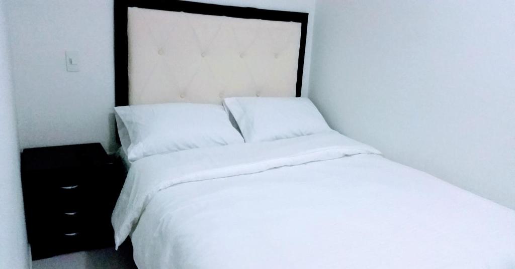 Postel nebo postele na pokoji v ubytování Hotel Mont Bleu