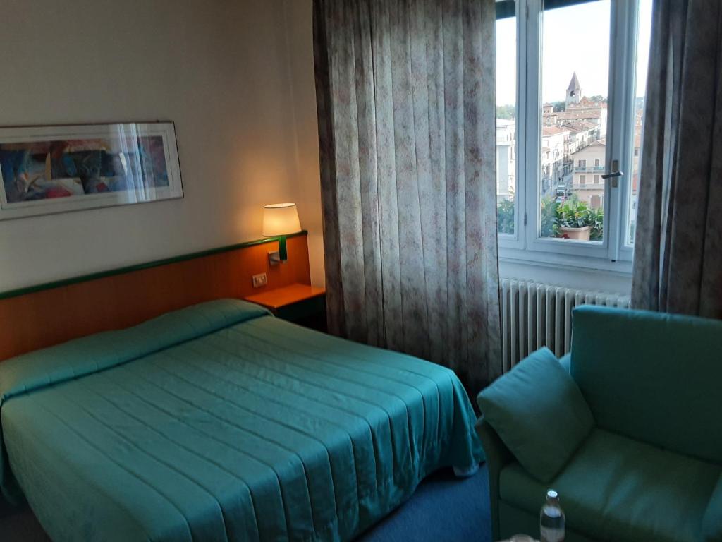 Postel nebo postele na pokoji v ubytování Hotel Ramoverde