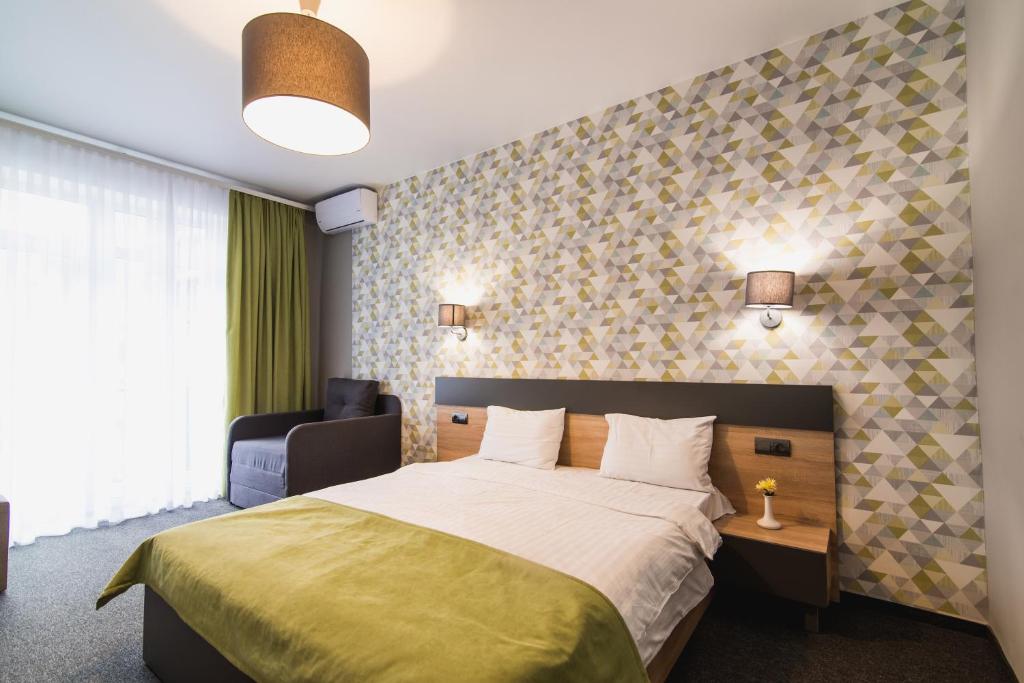 Postel nebo postele na pokoji v ubytování Arena Apart - Hotel
