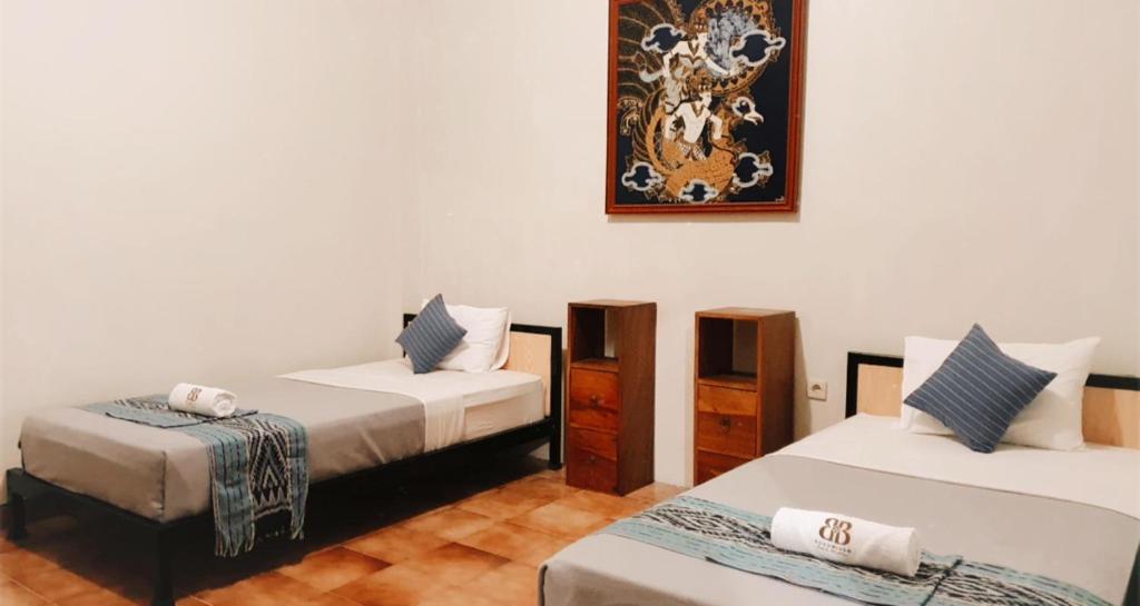 Postel nebo postele na pokoji v ubytování Borobudur Bed & Breakfast