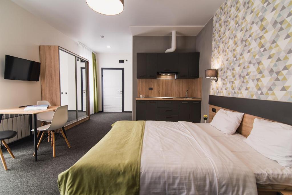 Postel nebo postele na pokoji v ubytování Arena Apart - Hotel