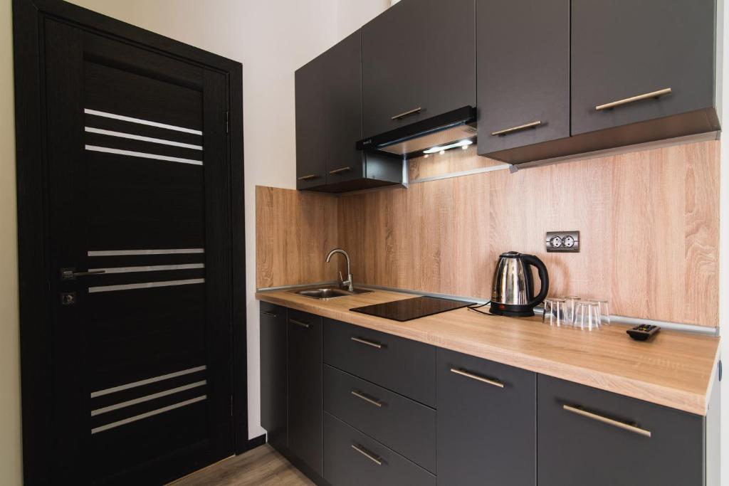 Kuchyň nebo kuchyňský kout v ubytování Arena Apart - Hotel