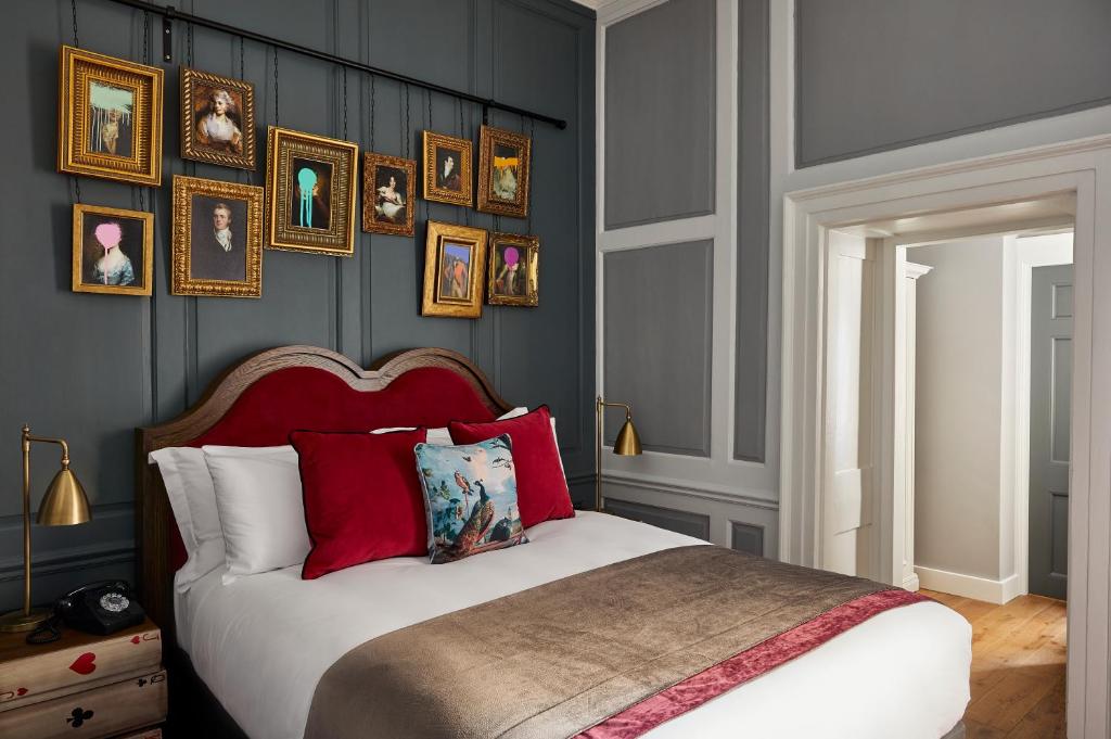 a bedroom with a bed and a painting on the wall at Hotel Indigo - Bath, an IHG Hotel in Bath