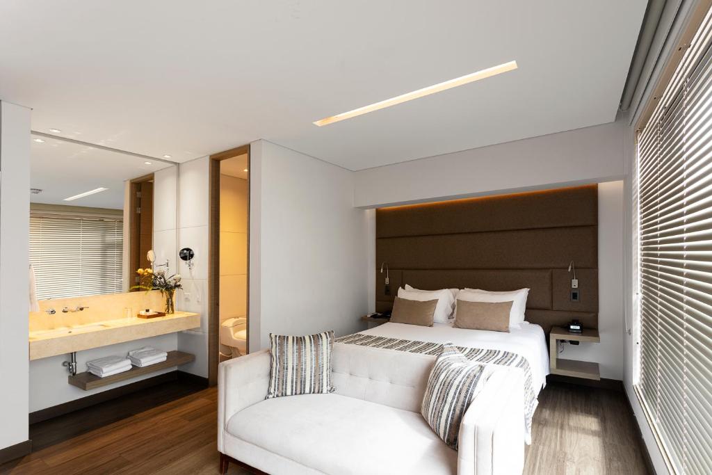 Postel nebo postele na pokoji v ubytování bs Rosales Hotel