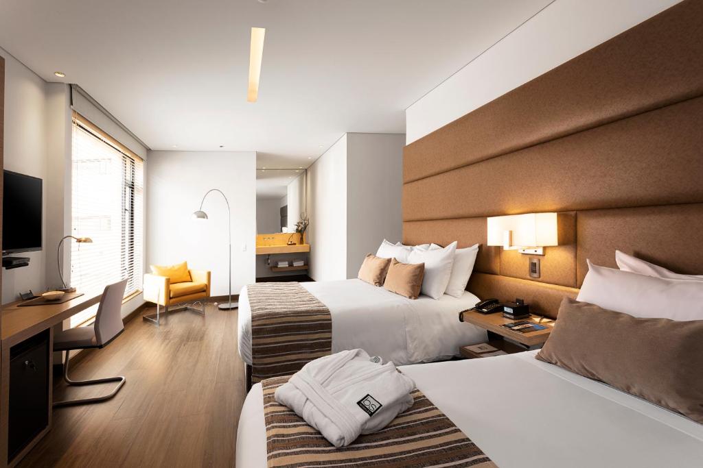 Postel nebo postele na pokoji v ubytování bs Rosales Hotel