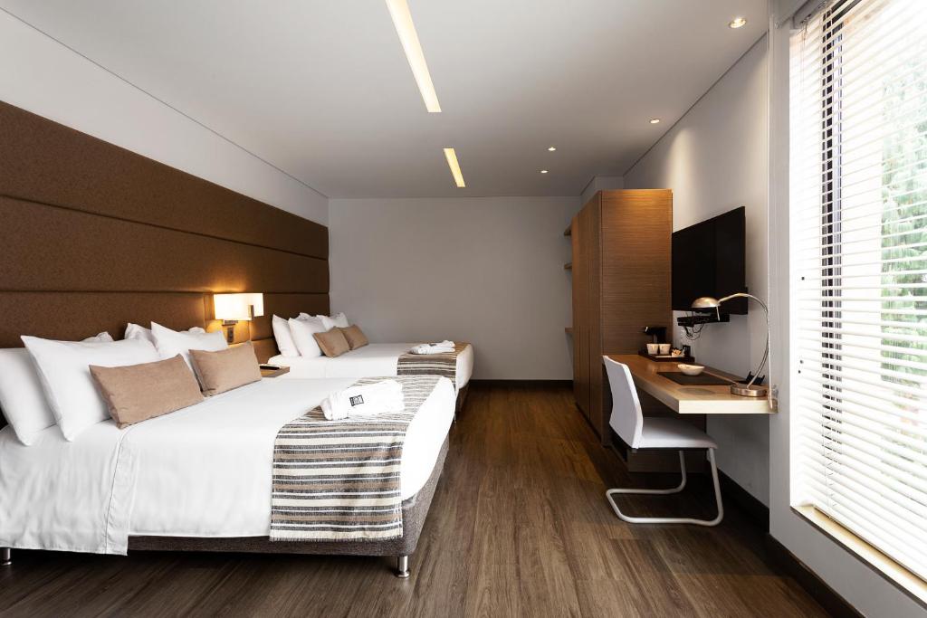 Postel nebo postele na pokoji v ubytování bs Rosales Hotel