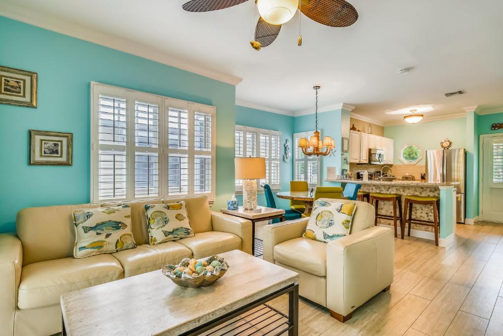 a living room with a couch and a table at Harbor Villa in Duck Key