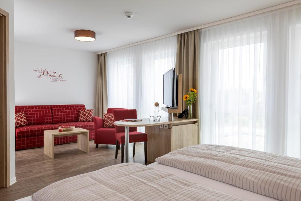 Postel nebo postele na pokoji v ubytování Kohlers Hotel Engel