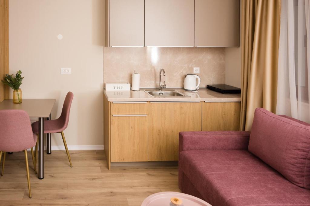 Kuchyň nebo kuchyňský kout v ubytování Urban Residence Apartments