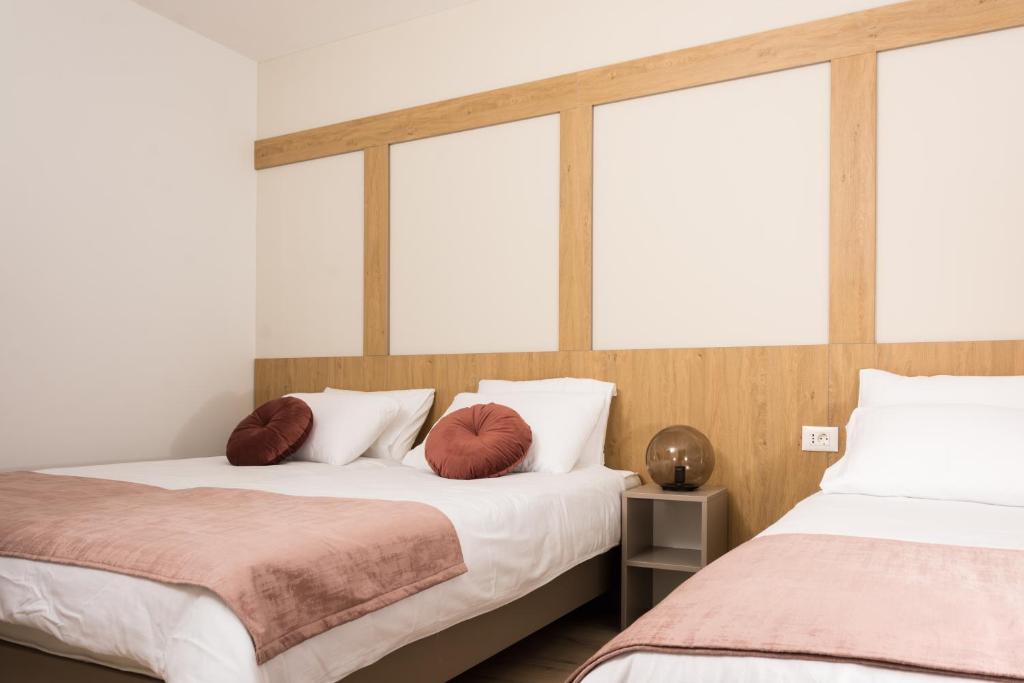 Postel nebo postele na pokoji v ubytování Urban Residence Apartments