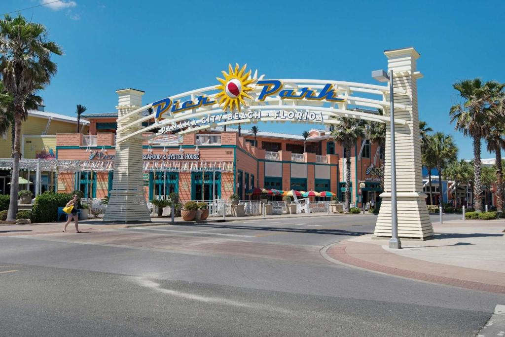 a large building with a large sign on a street at Commodore 1305 in Panama City Beach