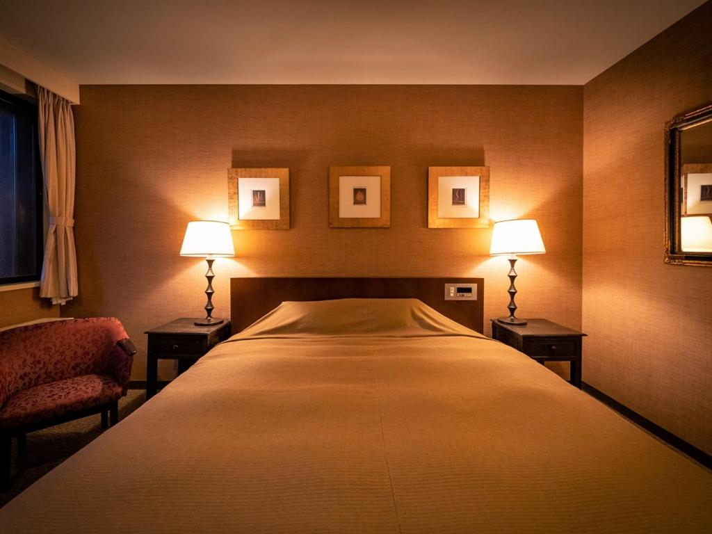 Postel nebo postele na pokoji v ubytování Apikogen Mori no Hotel