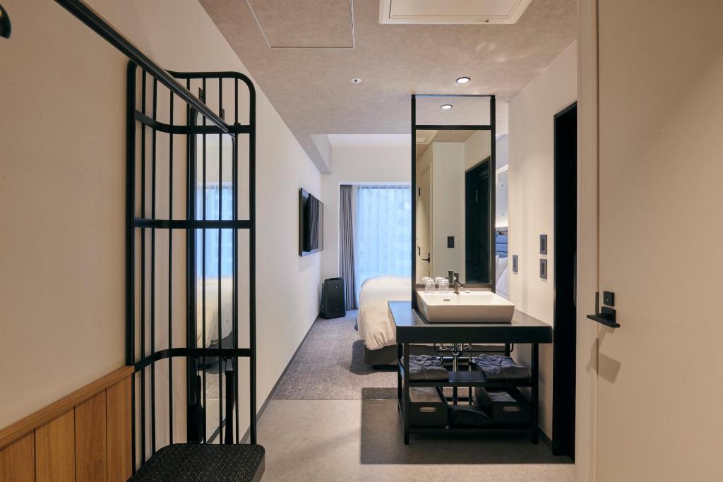 Postel nebo postele na pokoji v ubytování ibis Styles Nagoya