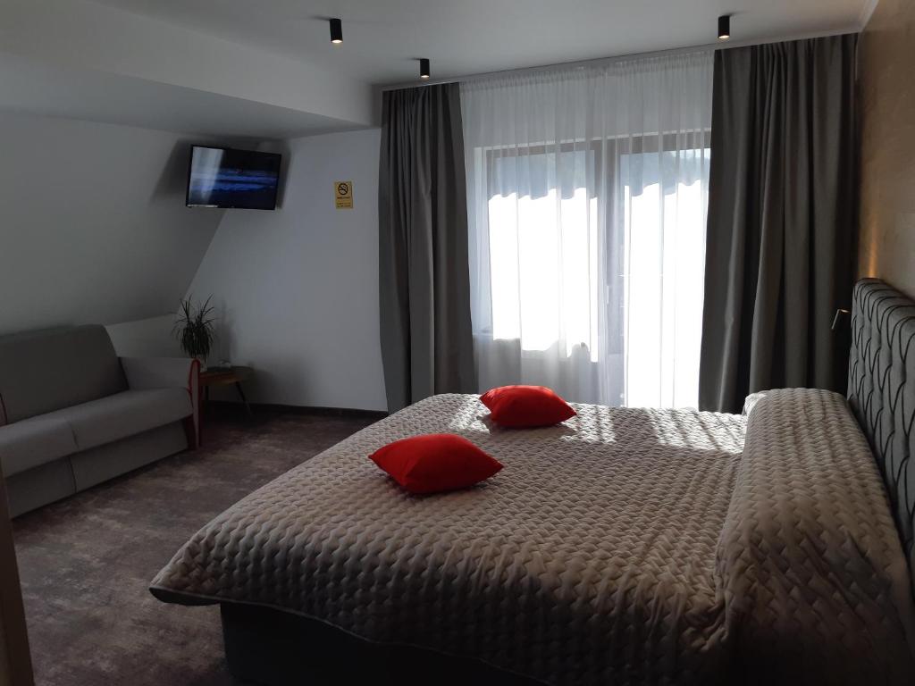Postel nebo postele na pokoji v ubytování Vila Trapez