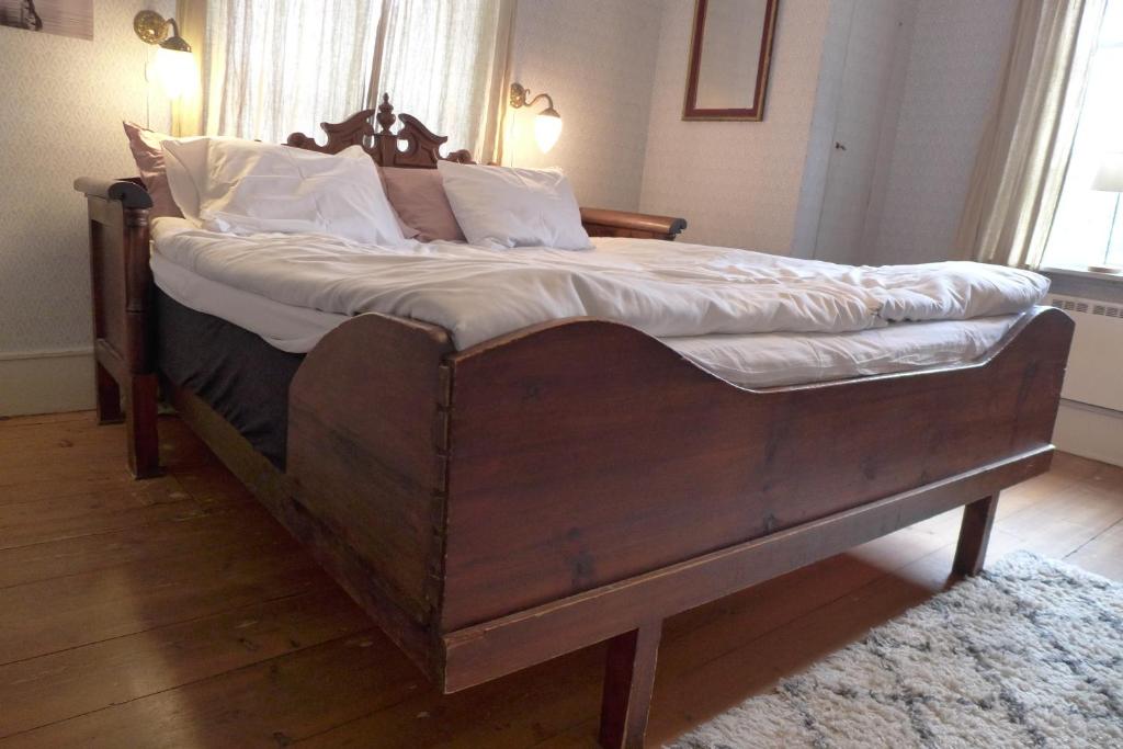 Postel nebo postele na pokoji v ubytování Prästgatanett Apartments