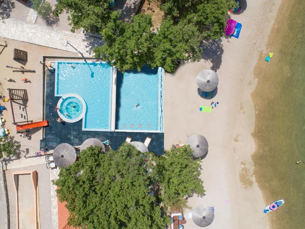 an overhead view of a swimming pool on a beach at Krk Mobile Homes in Klimno
