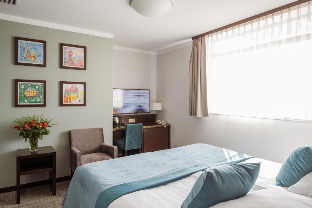 Posteľ alebo postele v izbe v ubytovaní Europeum Hotel