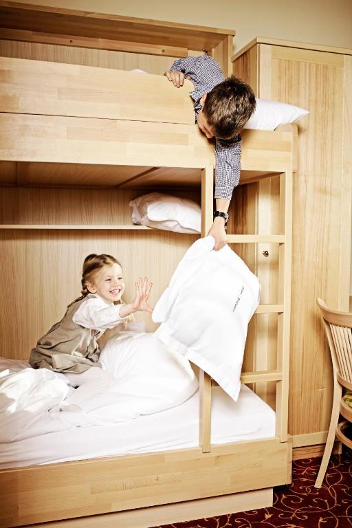 Postel nebo postele na pokoji v ubytování Hotel Alpen Residence
