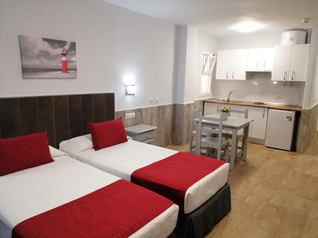 Cama o camas de una habitación en Apartamentos Puerta del Sur