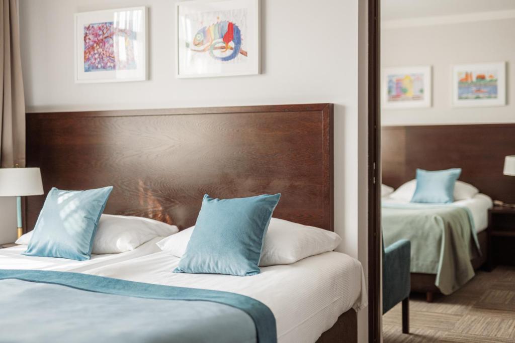 Posteľ alebo postele v izbe v ubytovaní Europeum Hotel