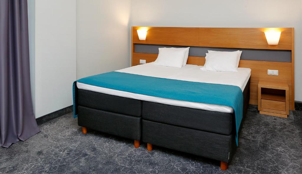 Voodi või voodid majutusasutuse Hestia Hotel Ilmarine toas