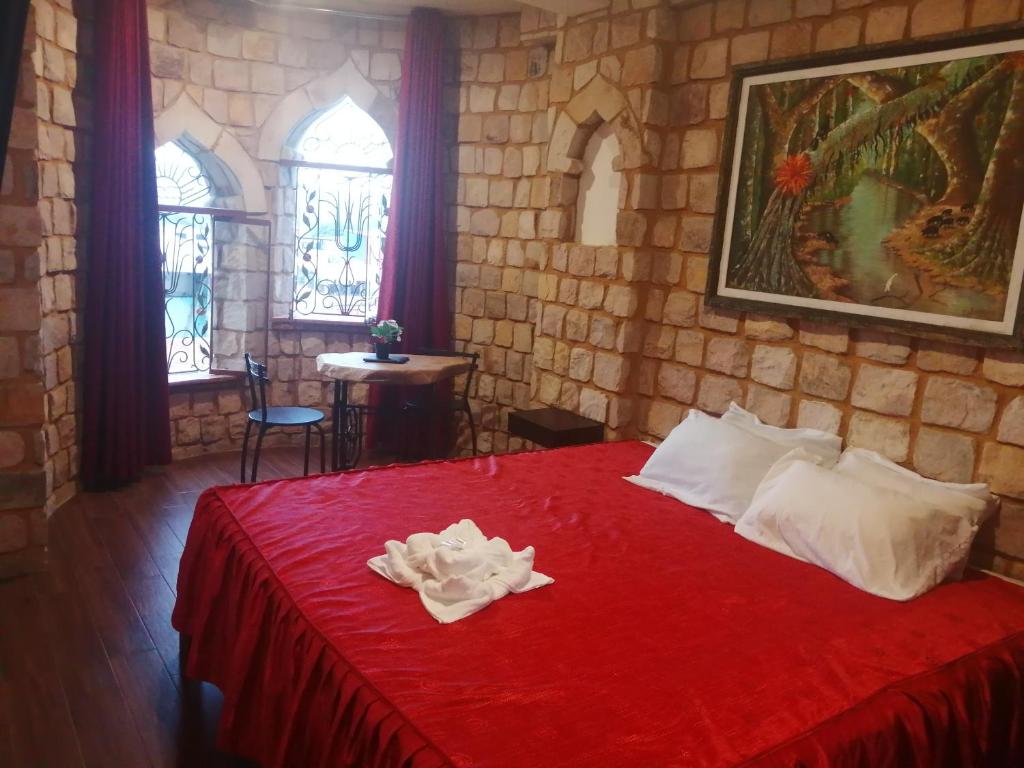 A bed or beds in a room at Castillo de Tarapoto