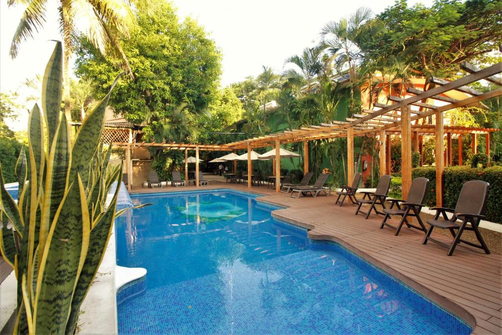 Bazén v ubytování Hotel Maya Tulipanes Palenque nebo v jeho okolí
