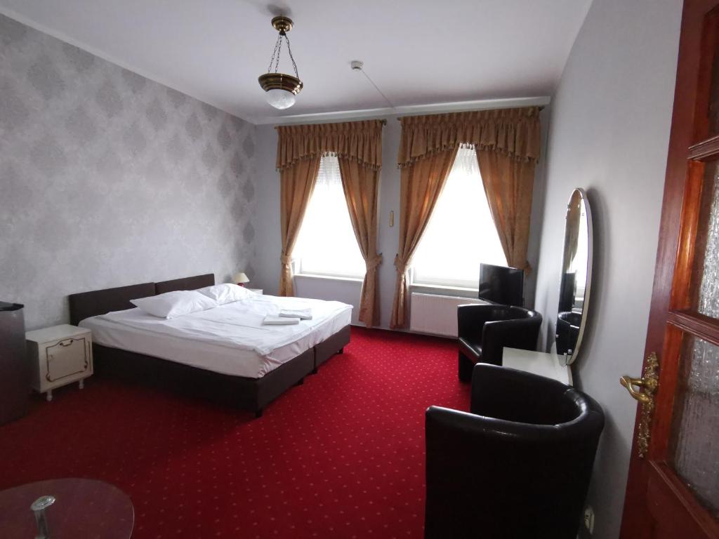 Postel nebo postele na pokoji v ubytování Hotel Nad Rzeczką