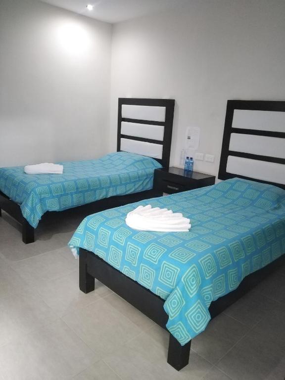 Postel nebo postele na pokoji v ubytování Hotel Sevilla Palenque
