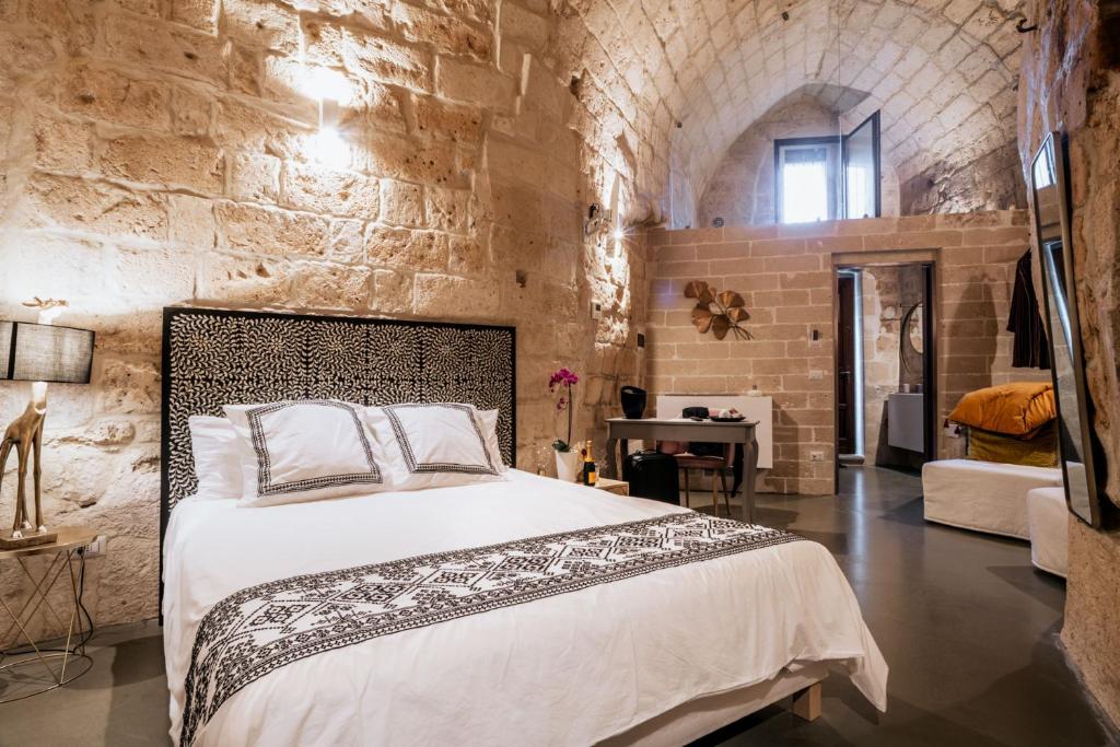 Postel nebo postele na pokoji v ubytování 19.52 Matera