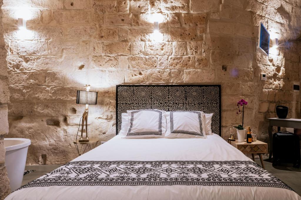 Postel nebo postele na pokoji v ubytování 19.52 Matera
