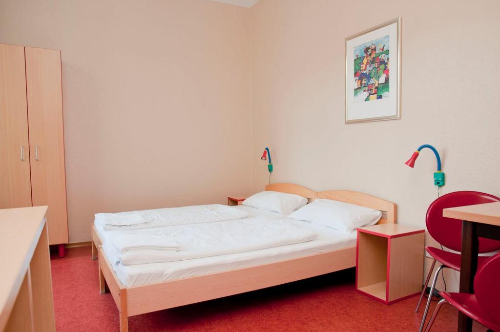 Postel nebo postele na pokoji v ubytování Happy Hotel Berlin