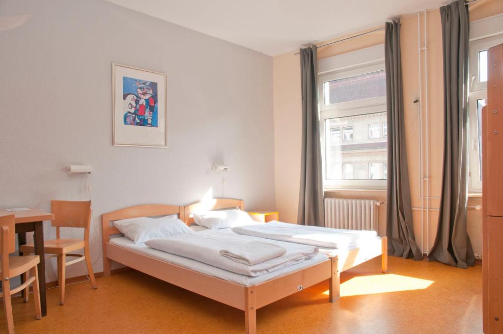 Postel nebo postele na pokoji v ubytování Happy Hotel Berlin
