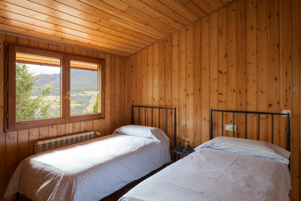 Postel nebo postele na pokoji v ubytování El Refugi de les Basses