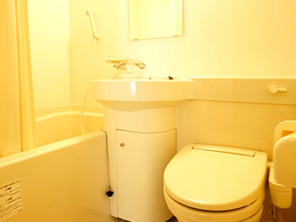 Koupelna v ubytování HOTEL LiVEMAX BUDGET Esaka