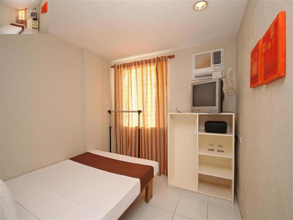 Postel nebo postele na pokoji v ubytování MR Holidays Hotel
