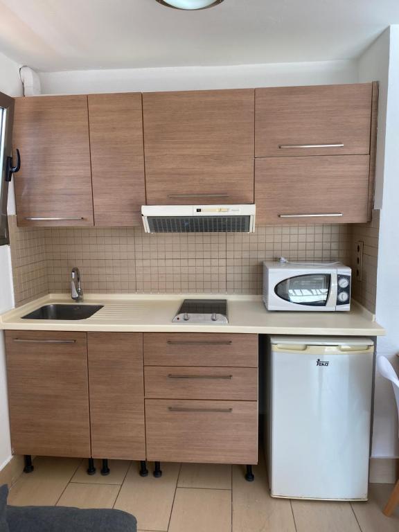 Kuchyňa alebo kuchynka v ubytovaní Apartamentos Oasis Sol