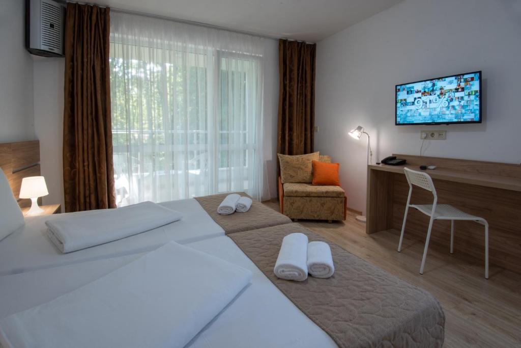 Postel nebo postele na pokoji v ubytování Ariana Hotel